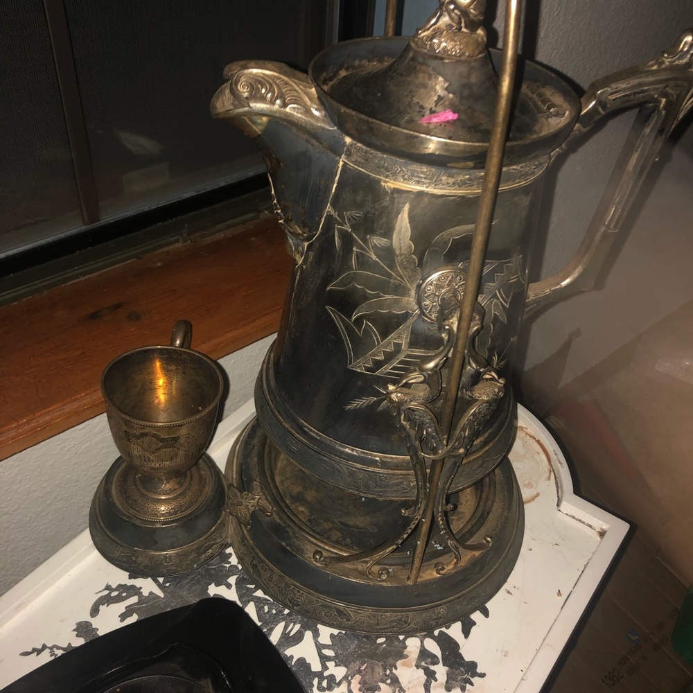 Silver tilting serving pitcher